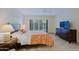 Bright bedroom with shutters, a ceiling fan, and a wooden dresser for storage at 8138 E Via De La Escuela --, Scottsdale, AZ 85258
