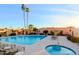 Community pool with lounge chairs and shade surrounded by manicured landscaping at 8138 E Via De La Escuela --, Scottsdale, AZ 85258