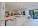 Updated kitchen with granite counters, stainless dishwasher, and breakfast bar open to living area at 8138 E Via De La Escuela --, Scottsdale, AZ 85258