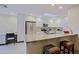 Modern kitchen featuring white cabinets, stainless steel appliances, and a granite countertop island with seating at 8138 E Via De La Escuela --, Scottsdale, AZ 85258