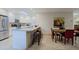 Bright kitchen with white cabinets, stainless steel appliances, granite countertops, and an eat-in island at 8138 E Via De La Escuela --, Scottsdale, AZ 85258