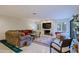 Comfortable living room with a fireplace, large sectional sofa, and stylish decor at 8138 E Via De La Escuela --, Scottsdale, AZ 85258
