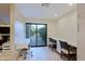 Bright office area with two built-in desks and sliding glass door access to outdoor patio at 8138 E Via De La Escuela --, Scottsdale, AZ 85258