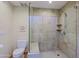 Glass enclosed shower featuring tiled walls, a built-in bench, and modern fixtures at 8138 E Via De La Escuela --, Scottsdale, AZ 85258