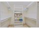 Spacious walk-in closet with custom shelving providing ample storage for clothes and accessories at 8138 E Via De La Escuela --, Scottsdale, AZ 85258