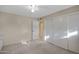 Neutral bedroom showcasing carpet, ceiling fan, and a large closet at 829 S Revolta Cir, Mesa, AZ 85208