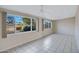 Versatile room featuring tile floors, ceiling fans, and large windows offering ample natural light at 829 S Revolta Cir, Mesa, AZ 85208