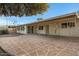 Large covered patio with decorative pillars, fans and stamped concrete at 829 S Revolta Cir, Mesa, AZ 85208