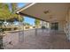 Spacious covered patio with decorative pillars, ceiling fans, and stamped concrete flooring at 829 S Revolta Cir, Mesa, AZ 85208
