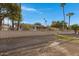 Well-maintained property with block wall and fence surrounding the property at 829 S Revolta Cir, Mesa, AZ 85208