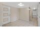 Bright hallway with neutral walls, tiled floor and a stylish paneled front door at 829 S Revolta Cir, Mesa, AZ 85208