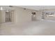Open floor plan with a large living room and ceramic tile flooring at 829 S Revolta Cir, Mesa, AZ 85208
