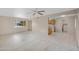 Open living room with a ceiling fan and a view to the kitchen at 829 S Revolta Cir, Mesa, AZ 85208