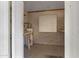 Small room with water heater and peg board to hang up items at 829 S Revolta Cir, Mesa, AZ 85208