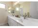 Bathroom showcasing a double sink vanity with modern fixtures and tile flooring at 834 E Kachina Trl, Phoenix, AZ 85042