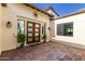 Welcoming home entrance featuring double doors, a sunburst decoration and meticulously landscaped front yard at 834 E Kachina Trl, Phoenix, AZ 85042