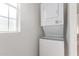 Efficient laundry room with stacked washer and dryer, and natural light at 8865 E Baseline Rd # 1731, Mesa, AZ 85209