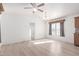 Bright living room with hardwood floors, ceiling fan and light and neutral decor at 8865 E Baseline Rd # 1731, Mesa, AZ 85209