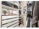 Spacious walk-in closet with custom shelving, drawers, and ample hanging space at 9260 E Greenway St, Mesa, AZ 85207