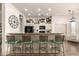 Kitchen bar with seating and white cabinets, ideal for casual dining and entertaining at 9260 E Greenway St, Mesa, AZ 85207