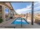 Backyard swimming pool featuring desert landscaping and privacy fence in a beautiful backyard at 9260 E Greenway St, Mesa, AZ 85207