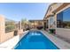 Backyard pool with covered patio area and privacy fence in landscaped yard at 9260 E Greenway St, Mesa, AZ 85207