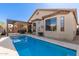 Beautiful backyard swimming pool with outdoor dining area and desert landscaping at 9260 E Greenway St, Mesa, AZ 85207