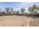 Large backyard featuring a neutral rock landscape with a block wall surround at 9405 W Palmer Dr, Peoria, AZ 85345