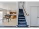 Entryway featuring staircase with blue carpet leading up to the second floor at 9405 W Palmer Dr, Peoria, AZ 85345