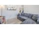Bright living room featuring grey couch and modern architecture at 9405 W Palmer Dr, Peoria, AZ 85345