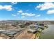 Stunning aerial view showcasing modern architecture against a mountain backdrop and lake, blending urban and natural beauty at 945 E Playa Del Norte Dr # 5005, Tempe, AZ 85288