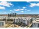 Aerial view of the residential community highlighting the proximity to the city and the lake at 945 E Playa Del Norte Dr # 5005, Tempe, AZ 85288