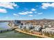 Aerial view of modern apartment complex with a waterfront and desert mountain views at 945 E Playa Del Norte Dr # 5005, Tempe, AZ 85288