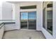 A modern balcony with a glass railing, offering a sleek and stylish outdoor space with views at 945 E Playa Del Norte Dr # 5005, Tempe, AZ 85288
