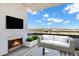 Outdoor balcony with cozy seating, fireplace and beautiful city views at 945 E Playa Del Norte Dr # 5005, Tempe, AZ 85288