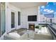 Relaxing outdoor balcony features cozy seating, fireplace and city views at 945 E Playa Del Norte Dr # 5005, Tempe, AZ 85288