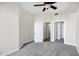Bedroom with neutral walls, carpet flooring, showcasing two doors, offering a blank canvas for personalization at 945 E Playa Del Norte Dr # 5005, Tempe, AZ 85288