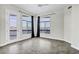 A bright bedroom featuring tile floors, large windows, and a balcony with scenic views at 945 E Playa Del Norte Dr # 5005, Tempe, AZ 85288