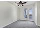 Bright bedroom with balcony access featuring carpeted floors and neutral-colored walls, offering versatility at 945 E Playa Del Norte Dr # 5005, Tempe, AZ 85288