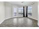 A bright bedroom featuring tile floors, large windows, and a balcony with scenic views at 945 E Playa Del Norte Dr # 5005, Tempe, AZ 85288