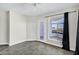 A bright bedroom featuring tile floors, large windows, and a balcony with scenic views at 945 E Playa Del Norte Dr # 5005, Tempe, AZ 85288