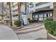Elegant building entrance with manicured landscaping, signage, and a modern facade at 945 E Playa Del Norte Dr # 5005, Tempe, AZ 85288