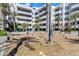 Beautiful courtyard featuring desert landscaping, palm trees and pedestrian lighting at 945 E Playa Del Norte Dr # 5005, Tempe, AZ 85288