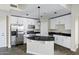 Bright kitchen featuring stainless appliances, granite countertops, and designer pendant lighting at 945 E Playa Del Norte Dr # 5005, Tempe, AZ 85288