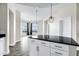 Modern kitchen with black granite countertops, white cabinets, and stainless steel appliances at 945 E Playa Del Norte Dr # 5005, Tempe, AZ 85288