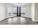 A bright living room featuring tile floors, large windows, and a balcony with scenic views at 945 E Playa Del Norte Dr # 5005, Tempe, AZ 85288