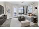 A bright living room featuring tile floors, modern furniture, and large windows offering scenic views at 945 E Playa Del Norte Dr # 5005, Tempe, AZ 85288