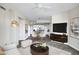 An open-concept living room with modern furniture and a glimpse into the stylish kitchen at 945 E Playa Del Norte Dr # 5005, Tempe, AZ 85288