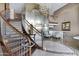 A grand lobby with curved staircase, chandelier, elevator and seating area at 945 E Playa Del Norte Dr # 5005, Tempe, AZ 85288