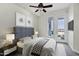 Well-lit main bedroom showcasing a large bed, balcony access and a cool color palette at 945 E Playa Del Norte Dr # 5005, Tempe, AZ 85288